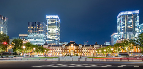Tokyo city skyline at railway station surround by modern highrise building at twilight time.  Tokyo city, Japan.