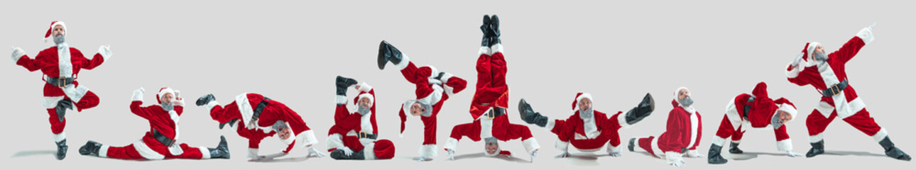 Happy Christmas Santa Claus on green studio background. Caucasian male model in traditional...