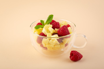 Raw ginger and raspberry for fruit tea in cup