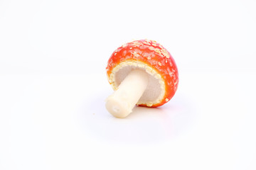 Red mushroom Toadstool, fly agaric, ion a white background, scientific name Amanita Muscaria