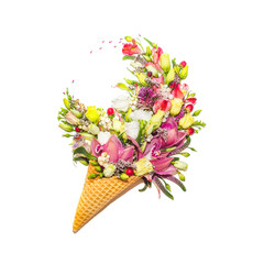 Waffle cone with flowers on white background