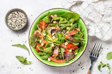 Salmon salad on white top view.
