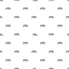 Vector seamless pattern with rhinos on white background.