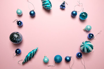 Christmas background with decorations and gift boxes on pink background