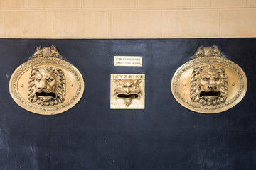Classic Spanish mail boxes with lion heads