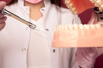 Closeup photo of process of making an anaesthesia in a jaw isolated