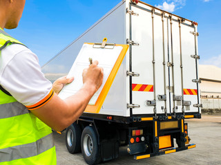 Worker hand holding clipboard  inspecting checklist load control the shipment with the truck...
