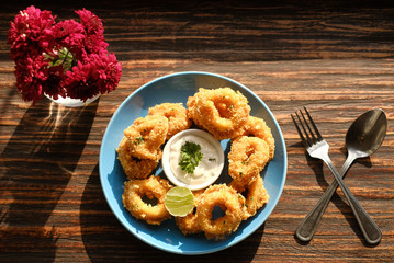 calamari ring with mayonnaise from top view 