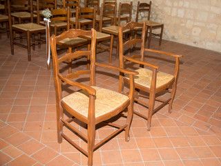 Fototapeta na wymiar Empty bride groom chairs in church for weeding