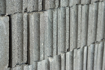 Close-up side view of Gray Brick Wall for Construction.