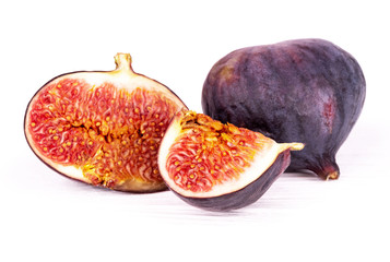 three slices of figs on a white background