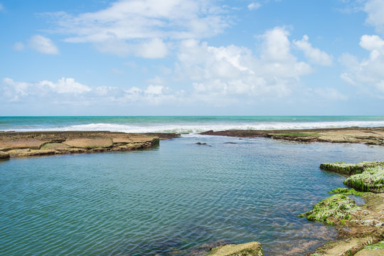 Natural swimming pool at the beach near the Hippie village in Arembepe (Bahia, Brazil)