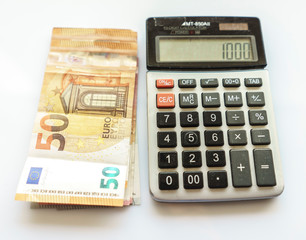 Banknotes and Calculator, Euro Banknotes on White Background