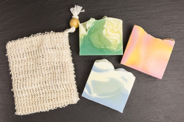 bars of eco friendly solid shower gel and soap bag to avoid plastic packaging - zero waste concept