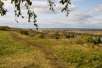 Autumn panoramic landscape with river and hills cloudy day in Konstantinovo village Russia