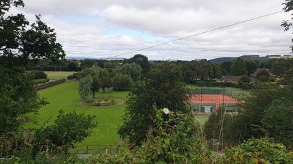 Landscape with tennis court