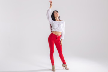 Latino dance, Improvisation, contemporary and vogue dance concept - young beautiful woman dancing on white studio background