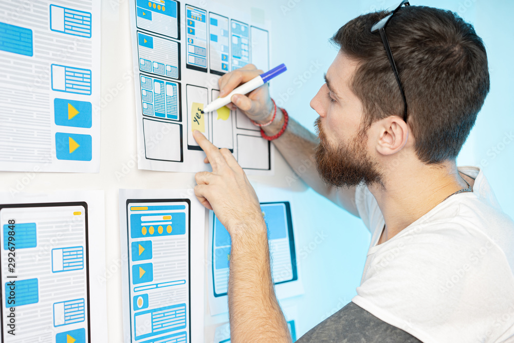 Poster the man works as a designer of mobile applications. the designer develops the most convenient user i