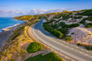 Cyprus. Coast of the Republic of Cyprus. Kouklia. A deserted road along the Mediterranean coast. Highway near the rock of Aphrodite. Petra Tou Romiou. Mediterranean landscape. Travelling to Cyprus.