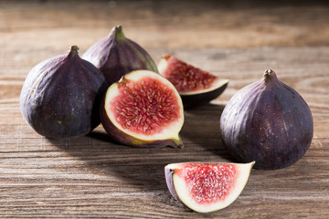 A few figs on an old wooden background.