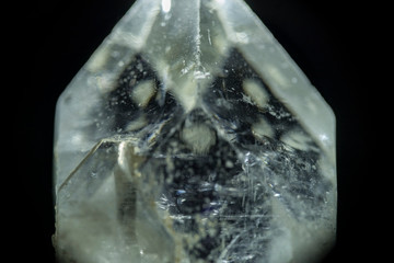 Macroscopic image of a small crystal cut with inner flaws, thought to have mystical powers.