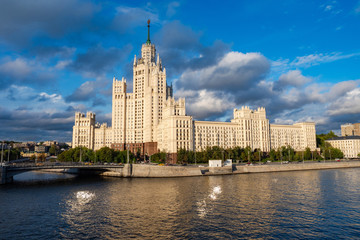 Fototapeta na wymiar Moscow. High-rise building in the city center. House against gray clouds. symbol of Moscow. View from the water to the house on Kotelnicheskaya embankment. Panorama of Moscow on a summer day.