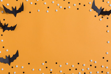 Halloween paper bats overhead view on a solid color