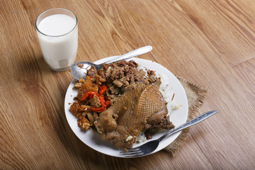 traditional indonesia food nasi gudeg with chicken Jack fruit and krecek.
