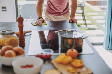 Cook finishing the process of preparing food