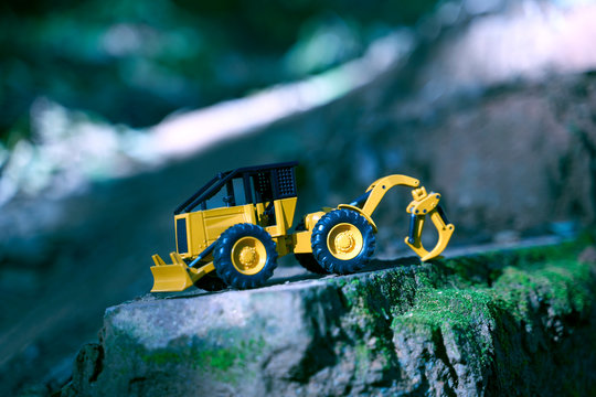 Bulldozer standing on rock hill.
