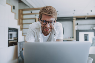 Cheerful man making a video call to his friend