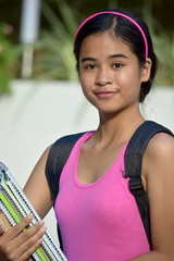 Serious Youthful Minority Person With School Books