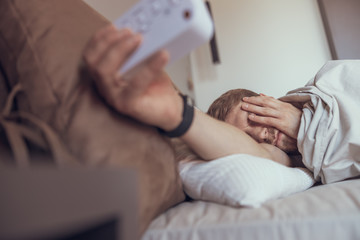 Man doing everything possible to stay in bed