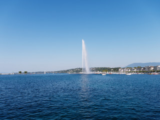 Famous Jet d'Eau fountain of the Geneva lake on a sunny day in Switzerland.