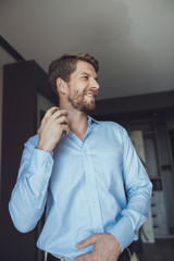 Cheerful man getting ready to go out