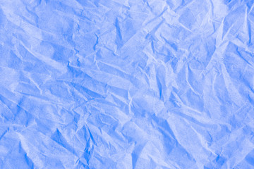 Blue color creased paper tissue background texture.