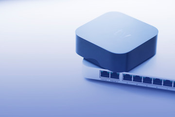 Smart home and media concept.  Cloud switch, smart media player and remote control on the white...