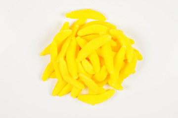 Juicy colorful jelly banana sweets isolated on white. Gummy candies.
