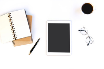 White desk office with tablet, notebook and other work supplies with cup of coffee. Top view ,copy space, flat lay.