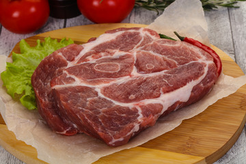 Raw pork neck steak