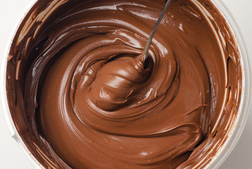 Background of chocolate paste with spoon