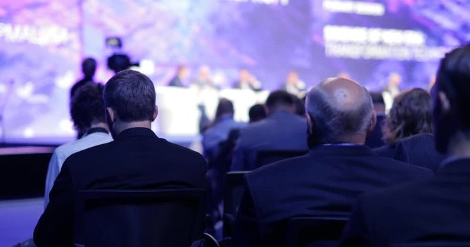 Educational science conference forum of modern technologies in scientific center. Briefing with viewers and journalists. International business and political summit in audience. Symposium with heads.