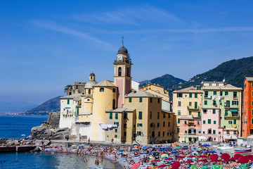 Fototapeta na wymiar Colorful buildings and beach at Camogli on sunny summer day, Liguria