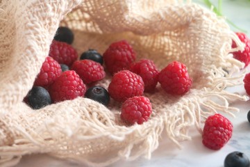 Fresh Raspberries and Blueberries in a sack