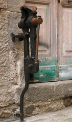 Antique Vice on the stone wall