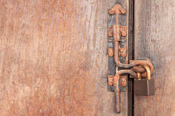 The Rusty lock with wood door, Old lock close home door.