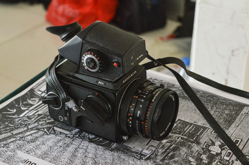 A well known camera brand hasselbald camera 501c TTL isolated on texture paper vintage look, retro...