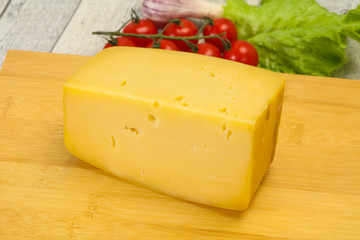 Hard yellow tasty cheese brick
