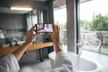 Close up of female hands that holding telephone