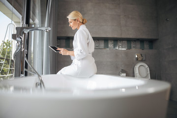 Charming female person checking her income mail